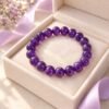 Bracelet perles d'améthyste 8 mm présenté dans son écrin