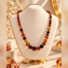 collier ambrine perles ambrees degrade vue face Collier AMBRINE vu de face, perles de tailles progressives aux tons chauds – Serinaé