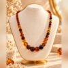 collier ambrine perles miel cognac caramel Collier AMBRINE pièce unique, perles brillantes miel, cognac, caramel et brun foncé – Serinaé