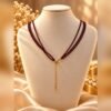 Collier GARANCE triple rang grenat 4 Collier GARANCE triple rang grenat avec chaînette de rallonge aux finitions dorées – Serinaé